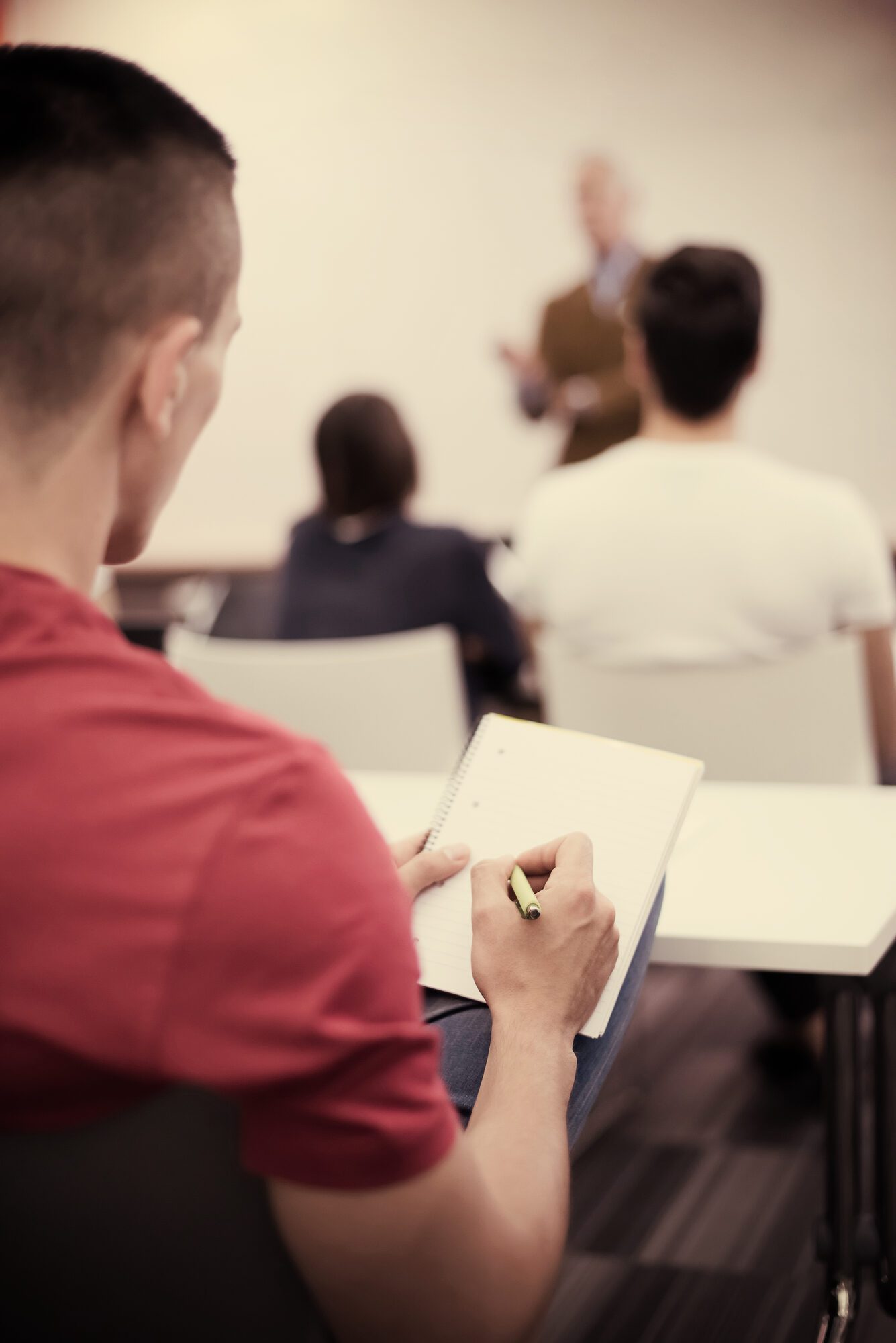 Applicant taking notes during a seminar