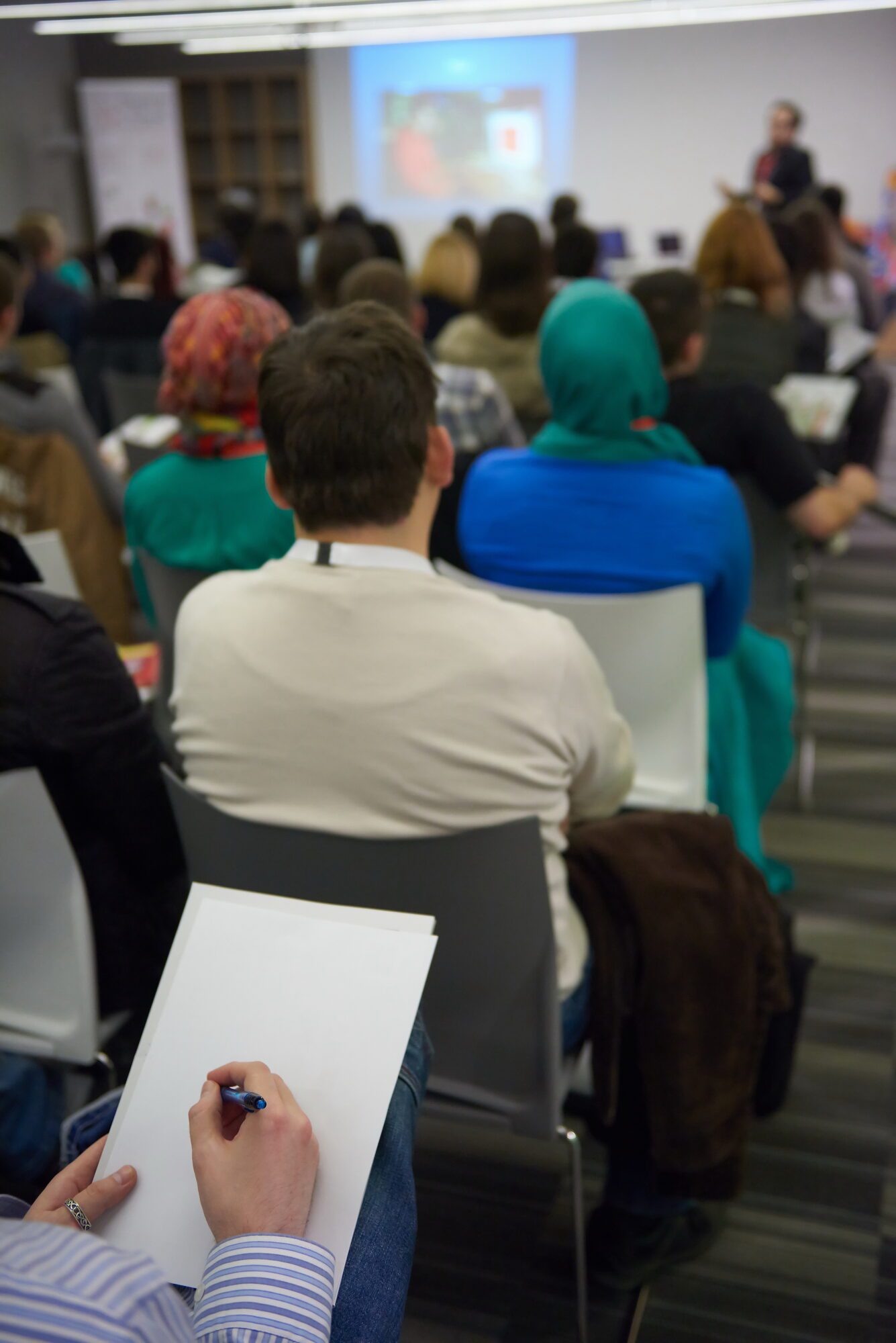 Participants taking notes during a training session