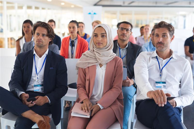 Audience listening to a speaker at a business seminar