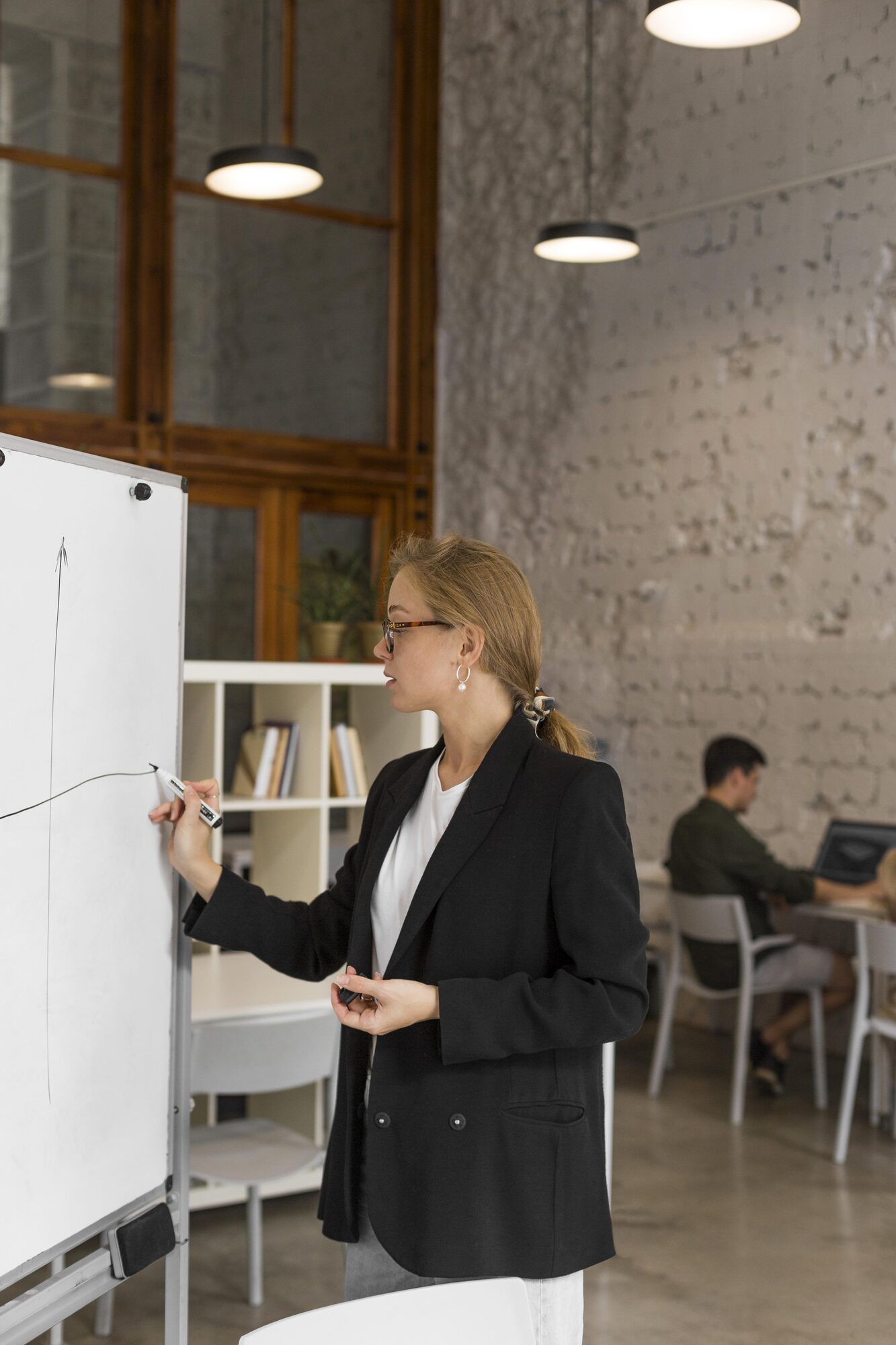Researcher working at a whiteboard